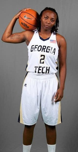 Bennett in the Georgia Tech number 2 uniform, holding a basketball