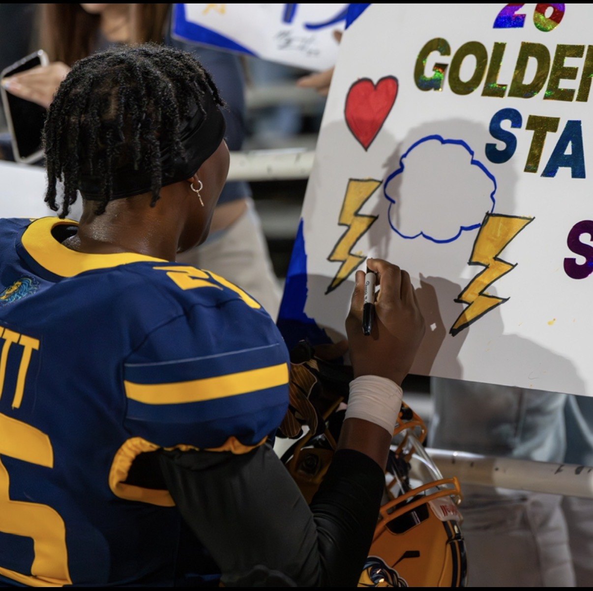Bennett signing a supporter's hand painted Golden State Storm poster after a game