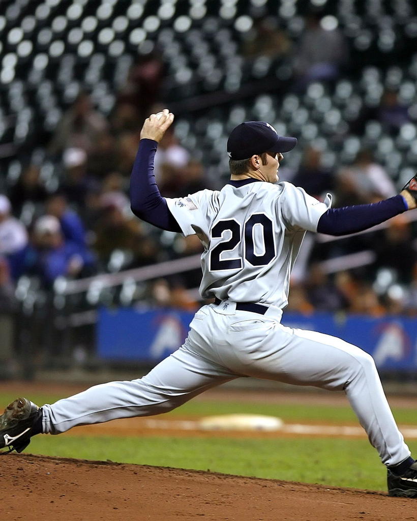 A pitcher at the top of the delivery